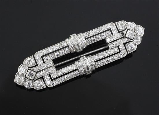 An Art Deco pierced platinum? and diamond set openwork brooch, 59mm.